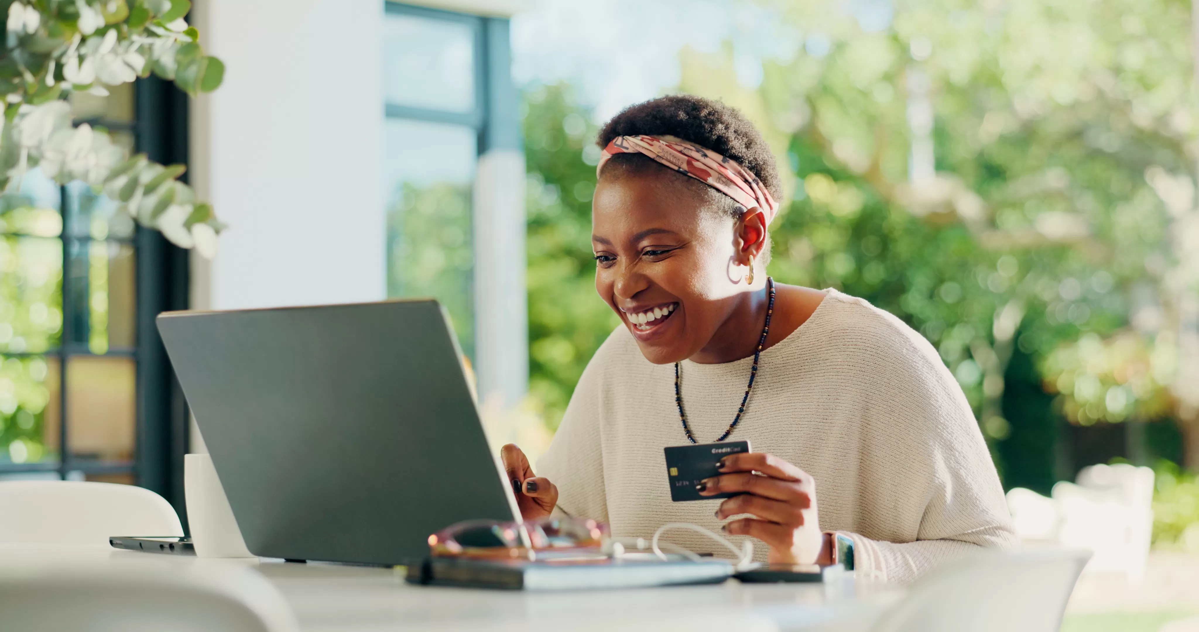 Business member managing a Transport CU Visa credit card on a laptop